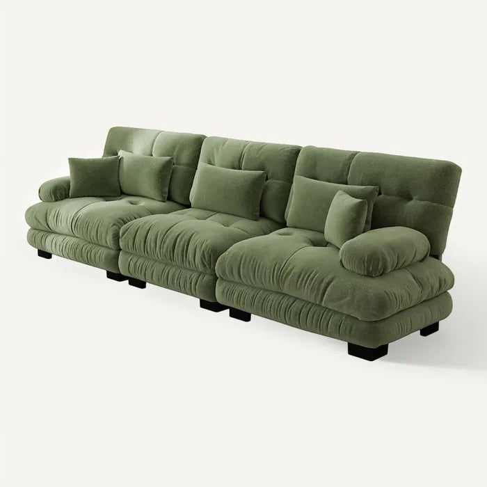 **Technische titel in het Nederlands: Comfortabele groene bank met plooien en kussens**